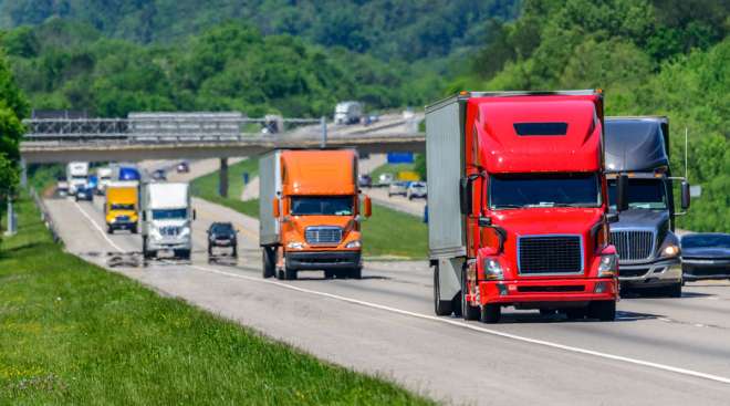 Several semis drive amid on an interstate in Tennessee.