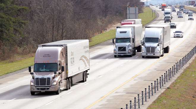 Trucks and other vehicles on highway