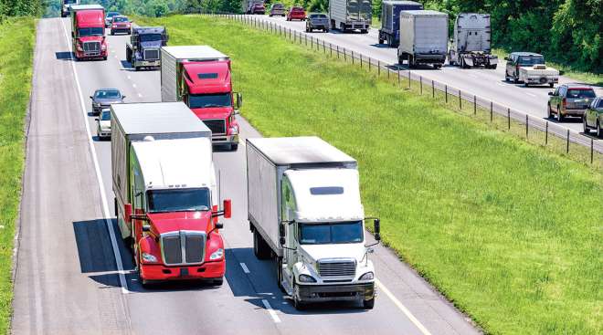 Trucks and other vehicles on highway