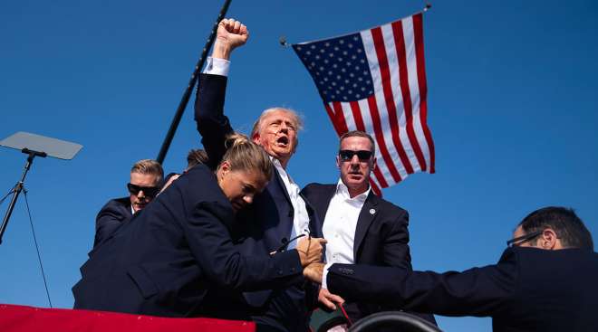 Donald Trump surrounded by Secret Service personnel